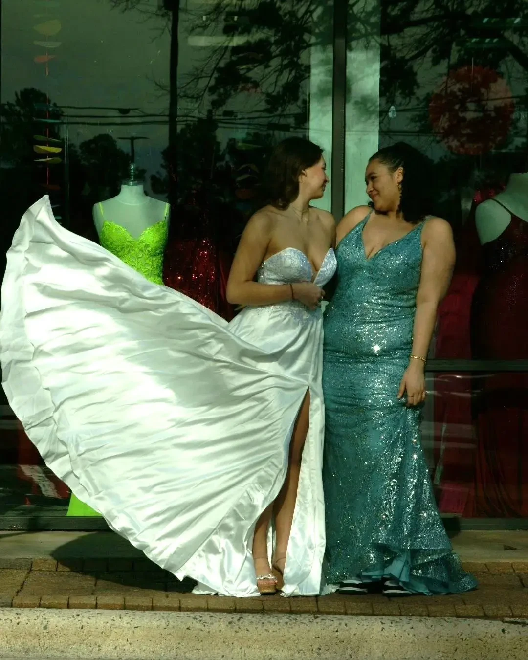 real savvi prom girls wearing white and teal gowns