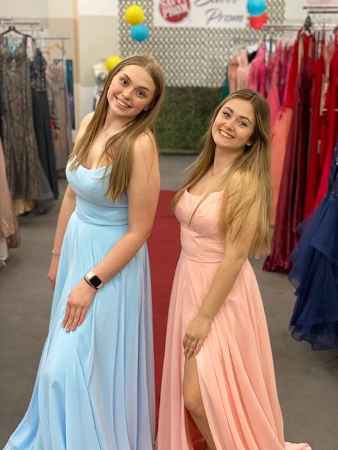 Models wearing a prom gowns