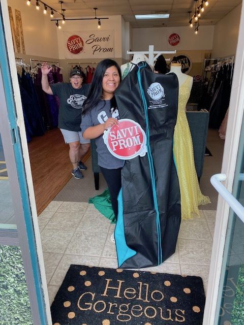Photo of the happy client with her prom dress