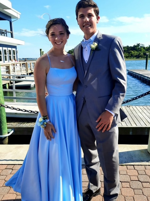 Photo of the couple in a prom gown and suit