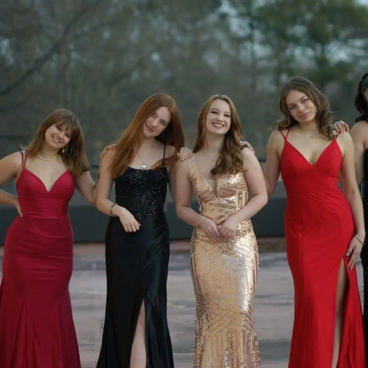 real savvi prom girl wearing gold prom dress, standing with 3 of her friends